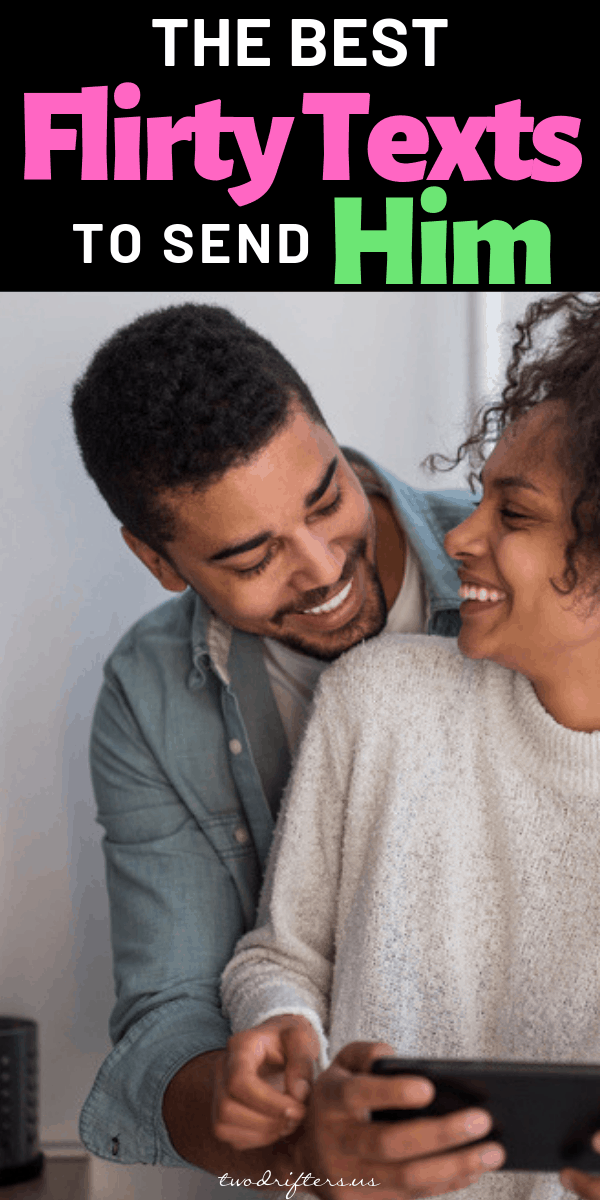 A couple laughs while looking at one another.